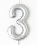 Silver birthday candle in the shape of a number "3"