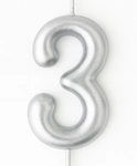 Silver birthday candle in the shape of a number "3"