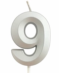 Silver birthday candle in the shape of a number "9"