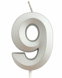 Silver birthday candle in the shape of a number "9"