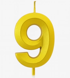 Gold birthday candle in the shape of a number "9"